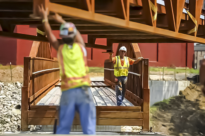 Two workers on Greenway Bridge